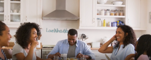 Family eating dinner at a large table