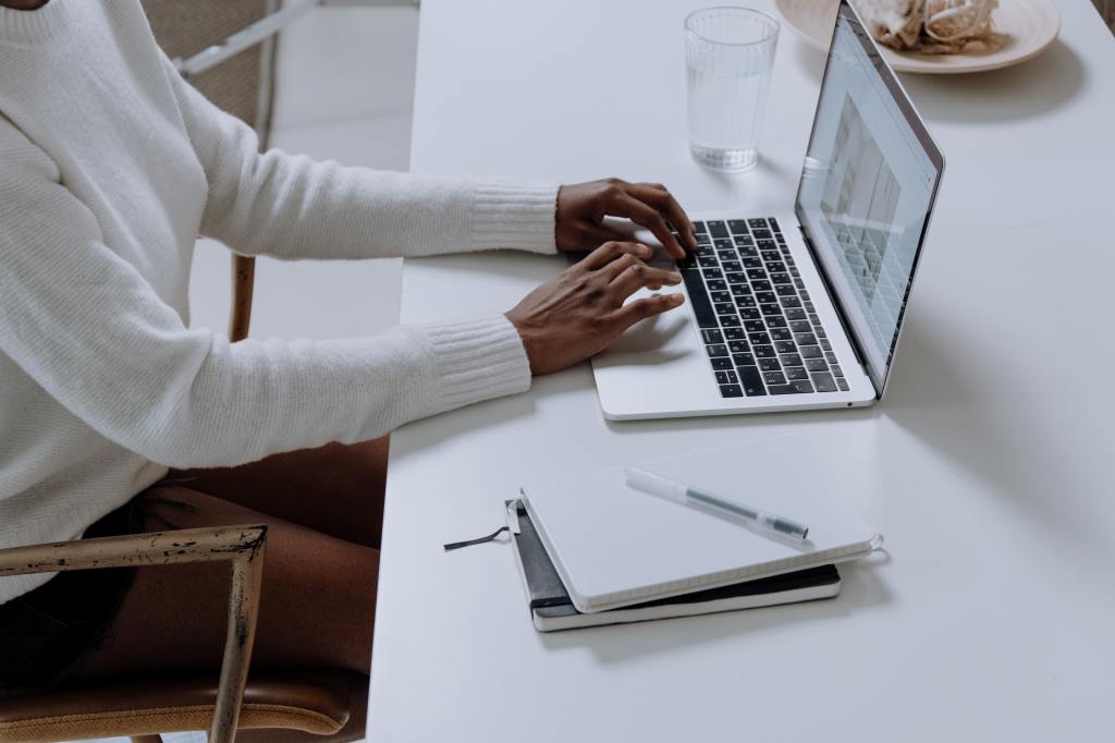 Woman typing on laptop