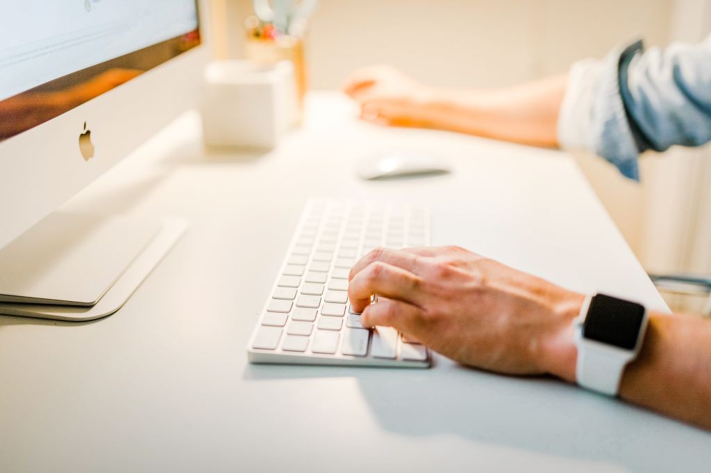 Person typing on computer